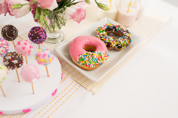 Donuts and cakepops on buffet at the party