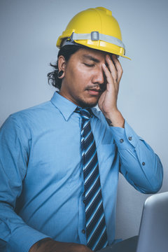 Business Man With A Safety Hat And Computer