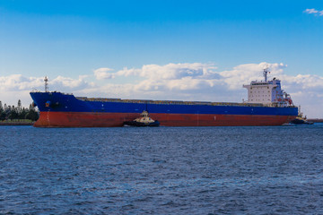 Cargo Ship is towing into the harbour of Newcastle