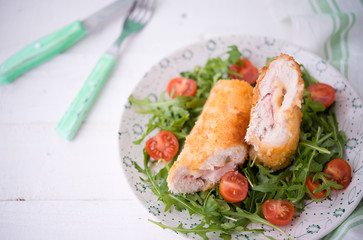 Chicken roll with cheese and fresh vegetables for dinner
