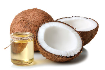 cut the coconut and coconut oil in a small glass jar on a white isolated background