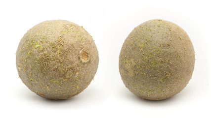 Two Organic Limonia or Kaitha (Limonia acidissima) isolated on white background.