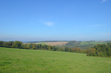 Fototapeta na wymiar Rural landscape in hills in Wallonia on sunny autumn day, Durnal, Yvoir