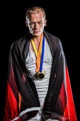 Athlete with german flag wrapped around his body