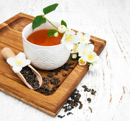 Cup of tea with jasmine flowers