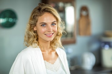 Beautiful young woman smiling at home