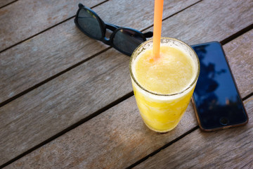 Fresh pineapple smoothie in the glass on relax time