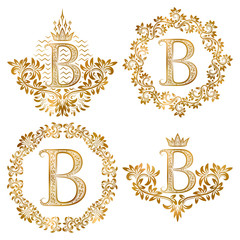 Golden letter B vintage monograms set. Heraldic monogram in coats of arms and round frames.