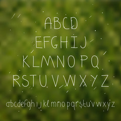 Cute hand drawn letter in the blurred background. Doodle type. 