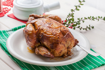 Baked chicken on white plate.