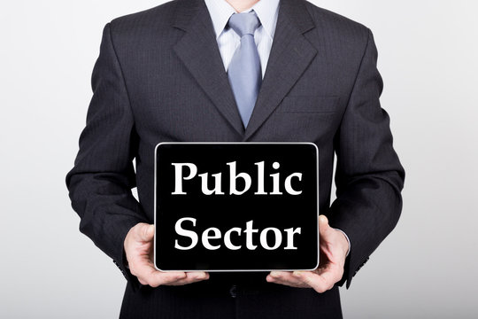 Technology, Internet And Networking In Business Concept - Businessman Holding A Tablet Pc With Public Sector Sign. Internet Technologies In Business