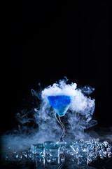 blue cocktail  and ice vapor