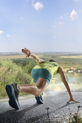 Fototapeta na wymiar Male runner sprinting during outdoors training for marathon run