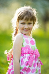 Happy girl in colored summer dress