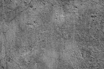 Fototapeta na wymiar Wall fragment with attritions and cracks