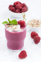 fresh berry smoothies with nuts, vertical