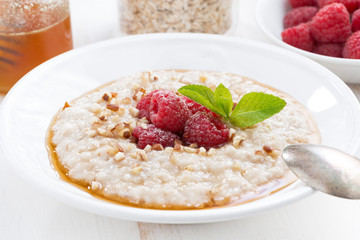 oatmeal with raspberries and honey, close-up