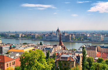 Naklejka premium Hungarian parliament in budapest and Danube river on a bright sunny day