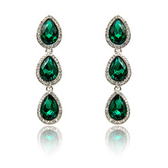 Pair of emerald earrings isolated on white
