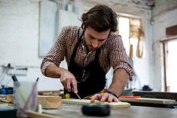 Carpenter working on his craft