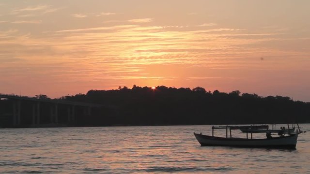 Traditional thai longtail boat at sunset Socha Beach. Cambodia, Sihanoukville province.