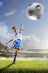 Naklejka premium Childrens are playing soccer on grand arena