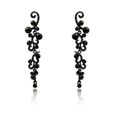 Pair of black spinel diamond earrings isolated on white
