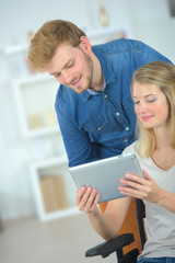 Couple using a tablet computer