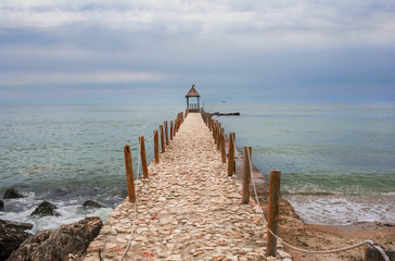 Fototapeta na wymiar Tranquil cloudy summer day on the shore of the Black Sea at Balchik, coastal town and seaside resort in Bulgaria