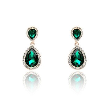 Pair of emerald earrings isolated on white
