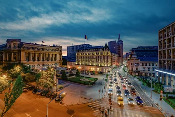 Fototapeten Bucharest, Romania - April 21, 2016: Bucharest city center and Calea Victoriei(Victory Avenue) seen from above at night. © agcreativelab