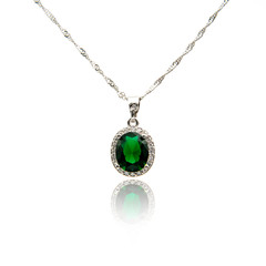 Emerald pendant isolated on white
