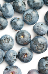 Bilberry or blueberry over white background