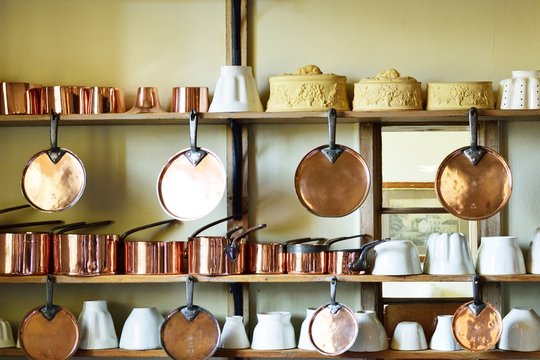 Copper pots and pans on Wall