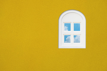 Window on the yellow wall