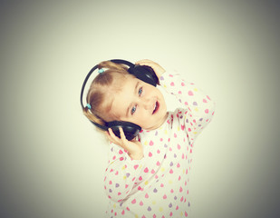 Little girl listening to music