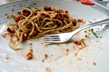 Unfinished meal of spaghetti bolognaise