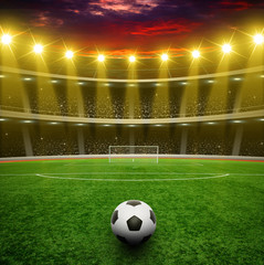 Soccer ball on green stadium