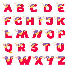 Alphabet with paper folded corner and sale tag.