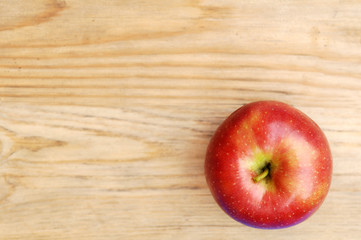 sweet red apple fruit on wood table