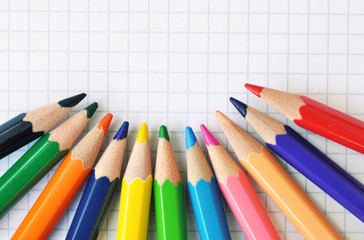 paper notebook with colored pencils