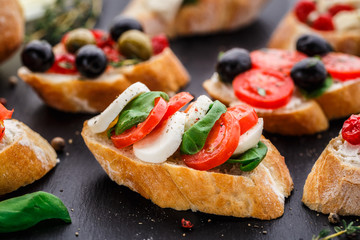 Bruschetta with tomatoes, mozzarella and basil