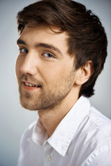 Fototapeta premium Portrait of young confident smiling businessman looking at camera.