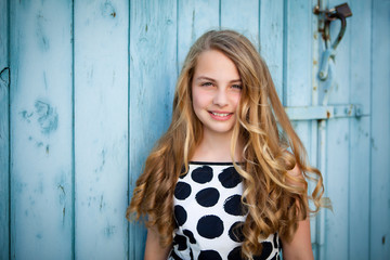 girl leaning on a wall