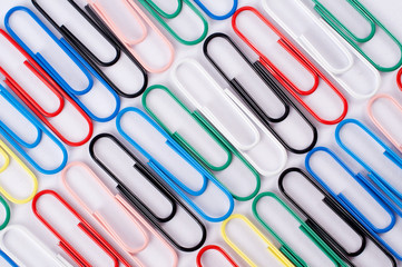 Colourful paperclips lined up
