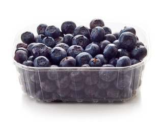 Blueberry in plastic container box isolated on white © bigacis