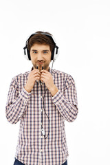Portrait of a handsome confident man, singing in head phones