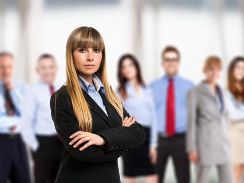 Woman in front of a group of business people