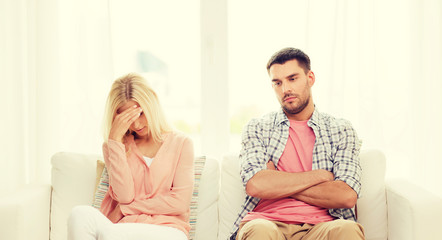 unhappy couple having argument at home