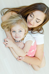 mother with daughter  on the floor 